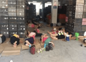 Workers sleeping on a factory floor during a break in 2017