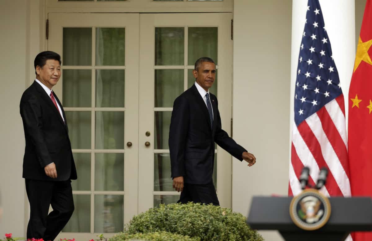 China's President Xi Jinping and U.S. President Barack Obama arrive for a joint news conference in the Rose Garden at the White House in Washington