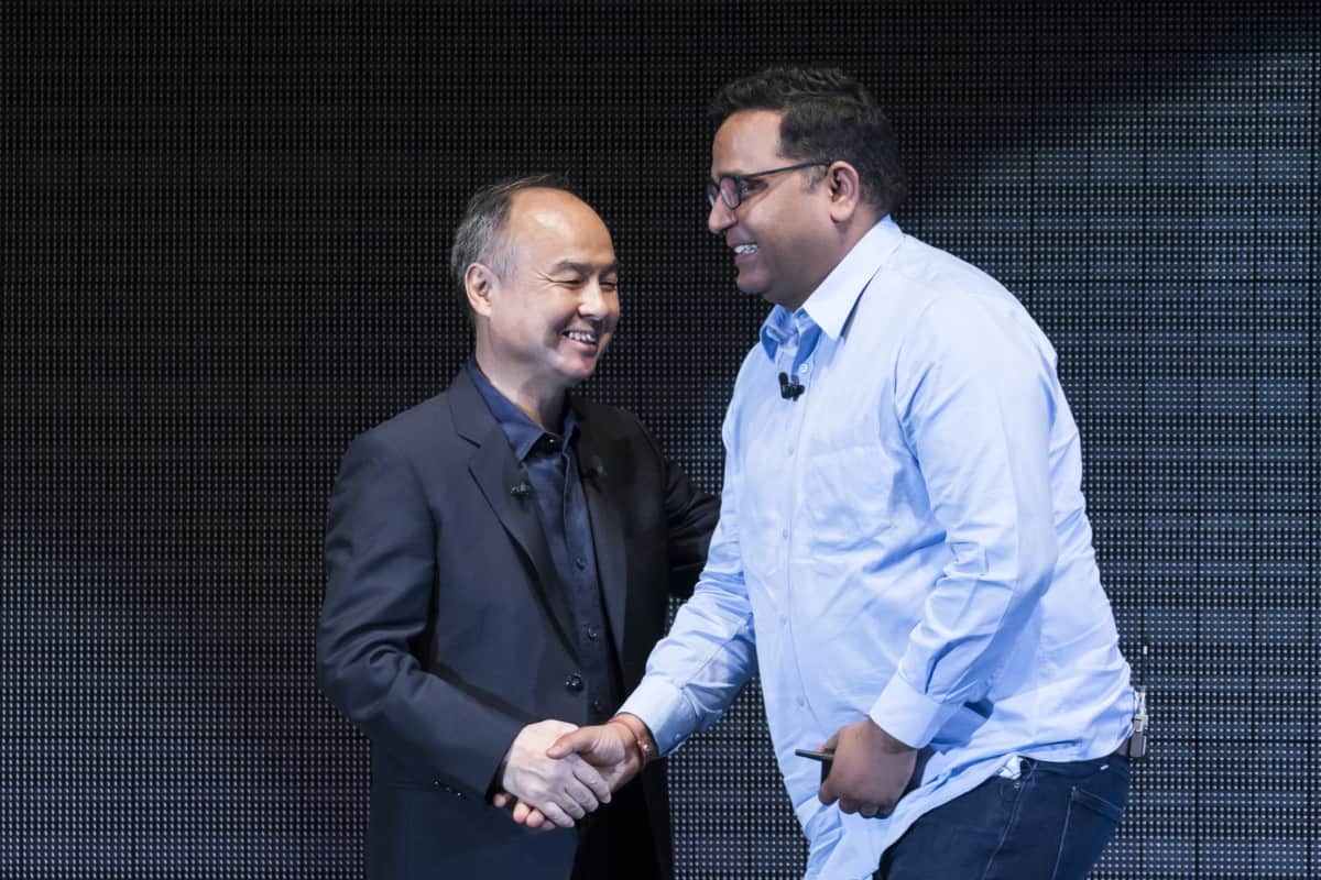 SoftBank Group Corp. Chairman and CEO Masayoshi Son shakes hands with Paytm Founder and CEO Vijay Shekhar Sharma.