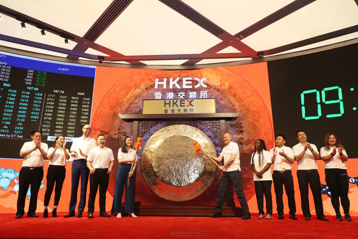 Alibaba customers strike the gong at the company's Hong Kong Stock Exchange listing ceremony Nov. 26, 2019.