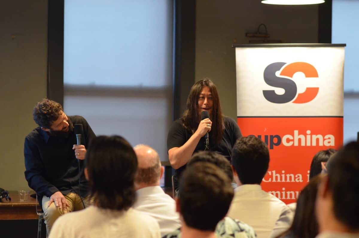 Kaiser Kuo hosting a live show of the Sinica podcast.